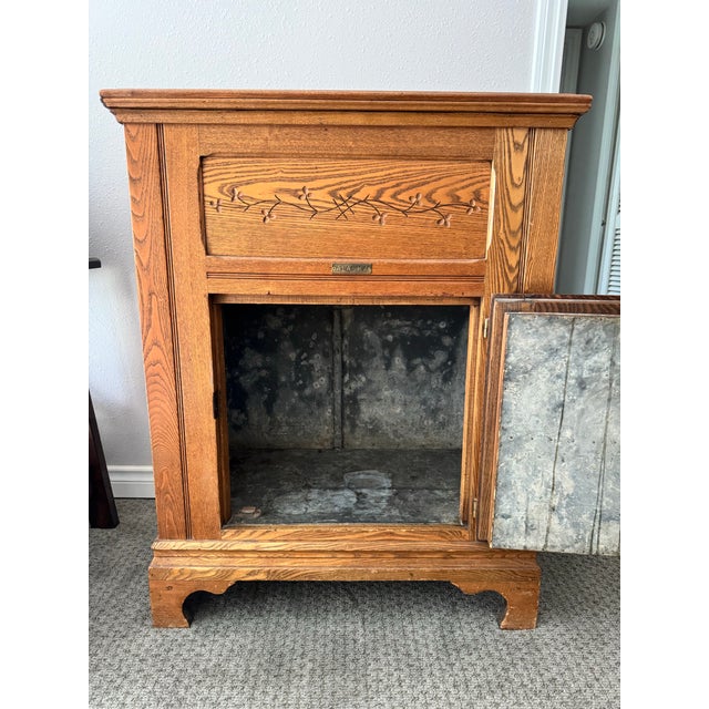 Vintage Alaska ice box and refrigerator cabinet from 1910s with original hardware, hand carvings and tin interior....