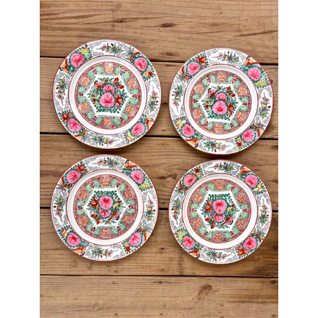 An exquisite set of four vintage Chinese porcelain dinner plates featuring the timeless Rose Canton pattern, richly hand-...