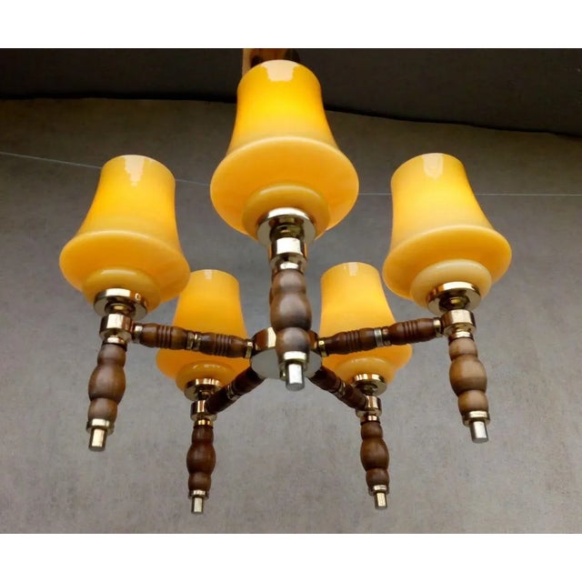 Material: wood, metal, yellow glass. Very nice and preserved Retro Vintage Chandelier, wood and metal holder golden color,...