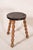 Antique two-toned bobbin joint stool with a rectangular plank top, turned bobbin legs, and box stretchers, showcasing...