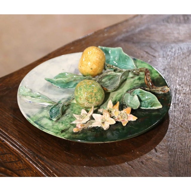 Add some color to your kitchen wall or dining room shelf with this beautiful antique Majolica wall platter. Crafted in...