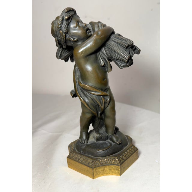 Up for sale is a an exquisite antique 19th century bronze statue of a putti, created by French artist Claude Michel...