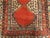 A rare and unusual hand knotted antique Persian rug. Rich in tone red center with paisley like symbol. The lower part of...