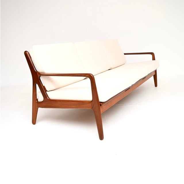 A rare and absolutely stunning Danish vintage sofa bed by Arne Vodder for Vamo Mobelfabrik. It was made in Denmark, and...