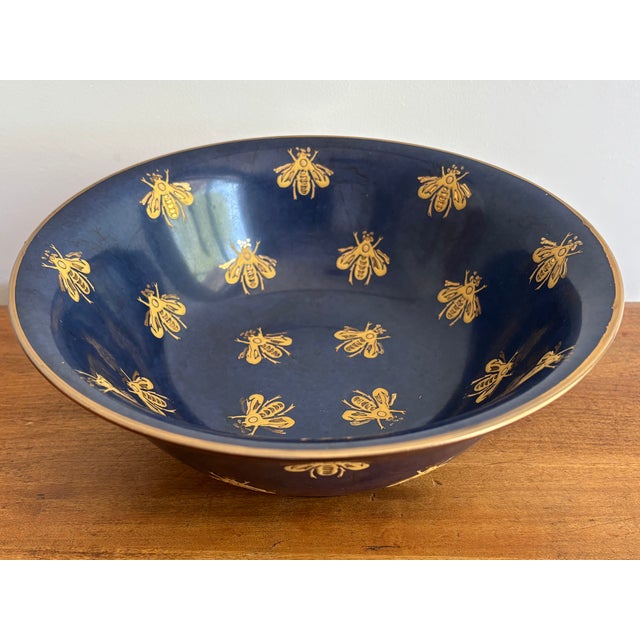 Beautiful 1990s hand-painted porcelain gold bee bowl with matte navy blue background. Made by Andrea by Sadek. For...