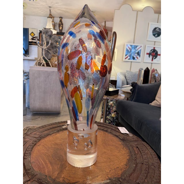 Mid 20th century hand blown Murano glass sculpture. The thick cased glass base has substantial sized bubble inclusions and...