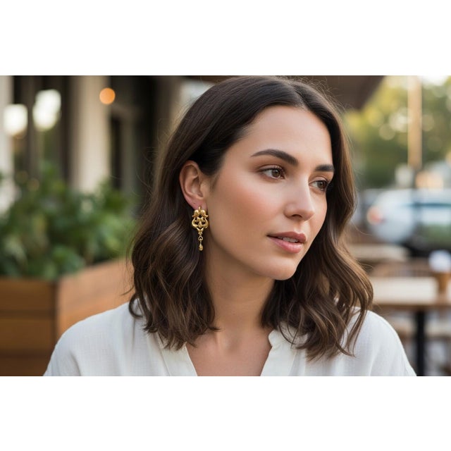 A captivating fusion of rarity, history, and timeless elegance, these Vintage 19k Yellow Gold Floral Earrings are a true...