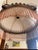 Incredibly intricate 1920s/30s era chandelier. Features a frosted glass dome held in place by sculpted brass arms and...