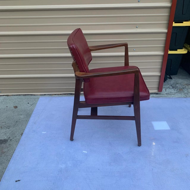 Vintage Gunlocke chair in good condition with red vinyl and a wood frame. The chair is super comfortable and once belonged...