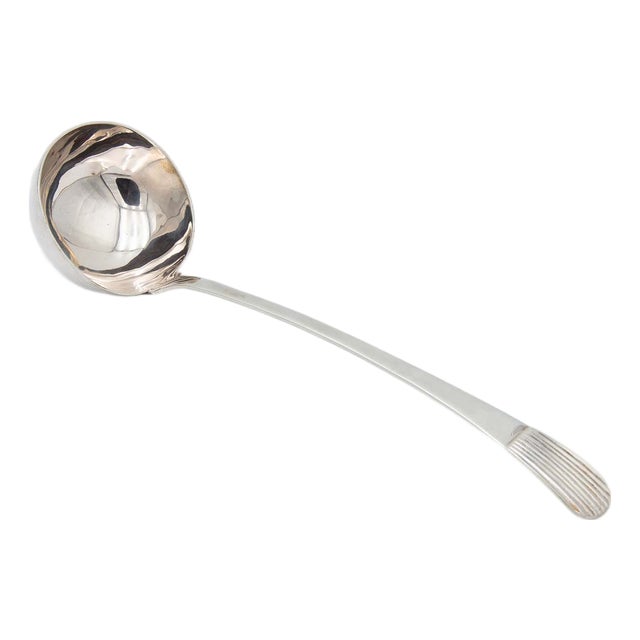 Silver Soup Ladle with Reliefs on the Handle For Sale