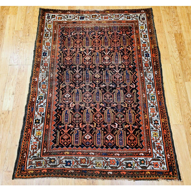 "Discover the exquisite artistry and authentic craftsmanship of this magnificent Early 20th Century Vintage Persian...