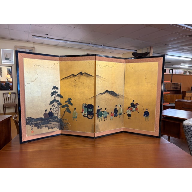 An elegant Japanese four panel byōbu folding screen featuring a richly detailed court procession rendered against a...