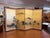 An elegant Japanese four panel byōbu folding screen featuring a richly detailed court procession rendered against a...