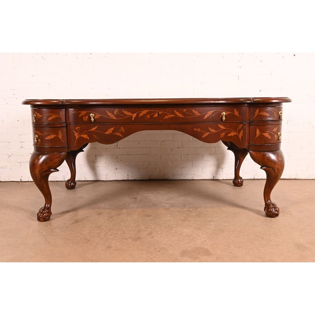 A stunning Louis XV or Chippendale style executive or writing desk Netherlands, Circa Late 19th Century Carved mahogany,...