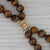 Gemstone Information: - Natural Tiger's Eye - Size - 10.2 - 12.2 mm Cut - Round Bead Shape Color - Bronze Brown Metal: 14k...
