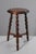 Mid-20th century tripod plant stand or stool in turned wood, in the style of Charles Dudouyt's designs. In very good...