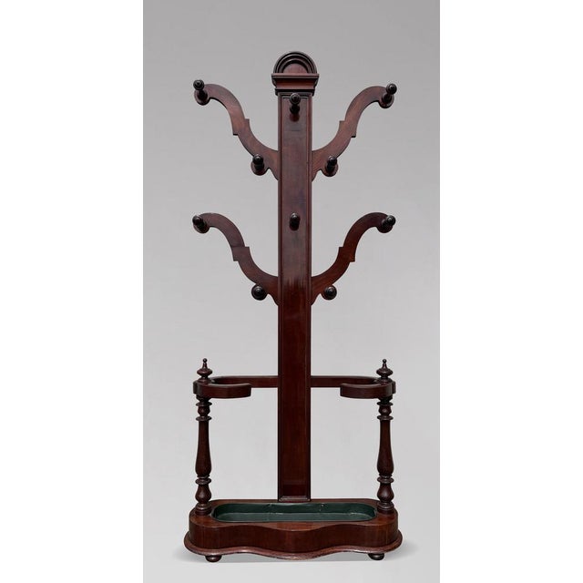 An elegant, large scale 19th-century Victorian solid mahogany hat and coat hall stand of fine quality and presence. The...
