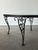 Metal Black Wrought Iron Rose Patio Coffee Table With Round Glass Top by Woodard, Mid-20th Century For Sale - Image 7 of 14