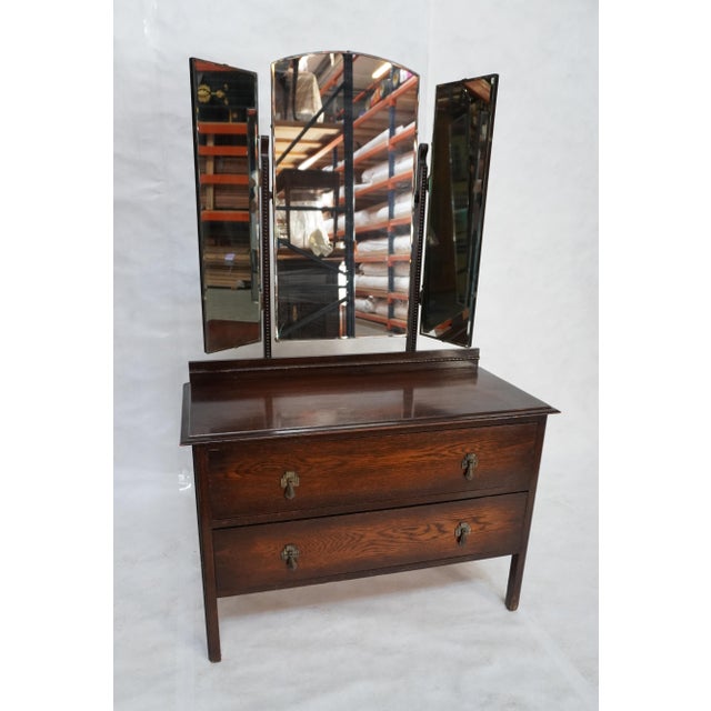 Adjustable tri-mirrored two-drawer wood dresser. Ornate deco drawer pulls, with beautiful carved wood detailing. Dresser...