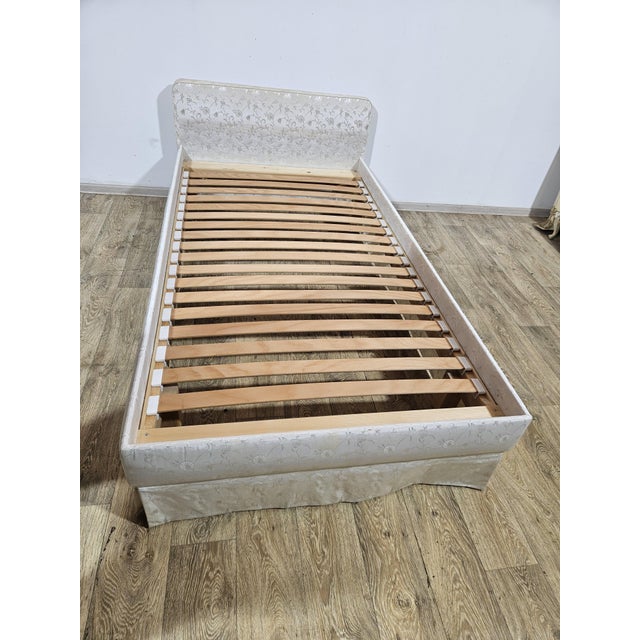 A stylish, upholstered single bed in a vintage style, perfect for a bedroom, guest room or children's room. Classic design...