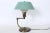 Walter Von Nessen Style Brass Swing Arm Desk Lamp with Pale Green Shade. Featuring a Brass column with extending and...