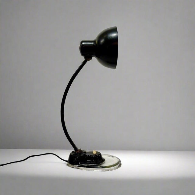 Marianne Brandt designed desk lamp from Germany, 1930's. Constructed of black painted steel and bakelite accents resting...