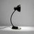 Marianne Brandt designed desk lamp from Germany, 1930's. Constructed of black painted steel and bakelite accents resting...