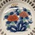 A beautiful hand-painted Asian bowl with two rows of cut open pierced work around the sides. The hand-painted design...