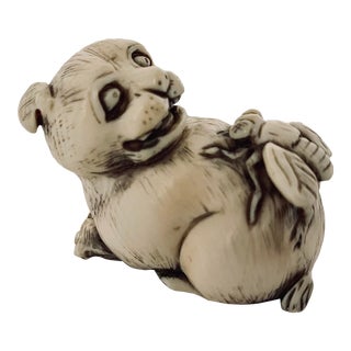Antique Japanese Netsuke of a Dog With a Bee on His Back For Sale