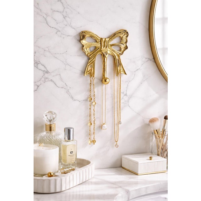 A charming blend of function and style, this vintage brass bow hook works beautifully as a great desk accessory, a...