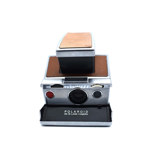 This is the iconic Polaroid SX-70 Land Camera, a masterpiece of 1970s engineering and a darling of the mid-century modern...