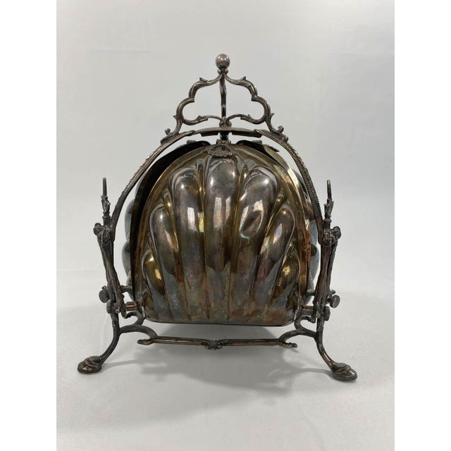 This antique silver-plated bun warmer is such a special piece! This was made in England in the 1870s. This piece includes...