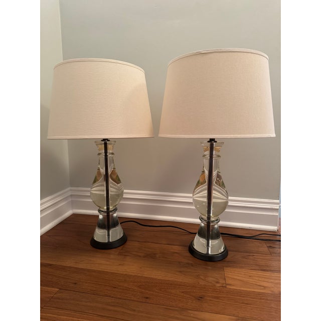 Pair of Pottery Barn Marston crystal lamp bases in very good condition. Includes shades, however purchaser may want to...