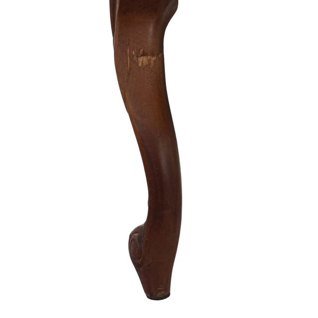 Library armchair with carved walnut arms, tapestry upholstery in a diamond pattern, alternating between cream and blue, in...