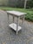 Iconic Karl Springer style python wrapped telephone/cocktail table. Table has two tiers and is finished in polished nickel...