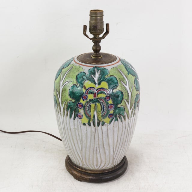 This antique table lamp is crafted from an authentic porcelain vessel featuring the traditional and highly symbolic Bok...