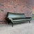 Sculptural Mid-Century Modern Sofa in Green Upholstery Striking sculptural mid-century modern sofa featuring a dramatic...