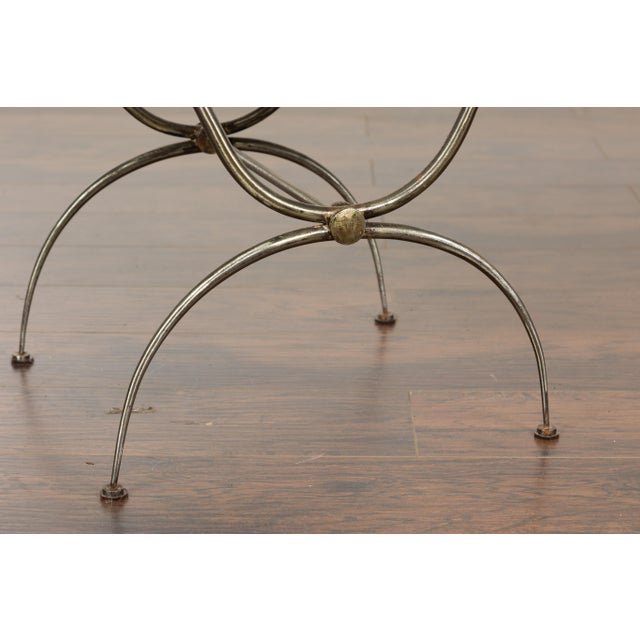 A French Midcentury steel side table with marble top, scrolling supports and arching half-moon legs. A French Midcentury...