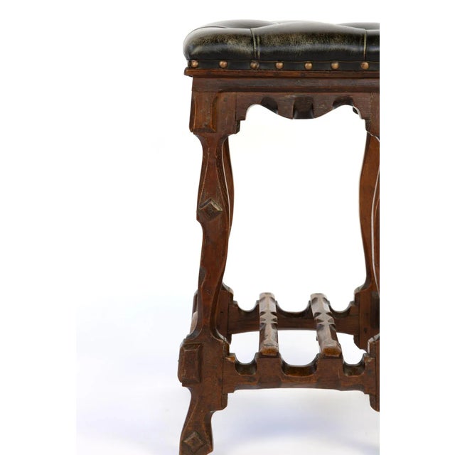 Arts and Crafts Period square upholstered stool, beautifully carved apron, legs and stretchers with , nailhead trim,...