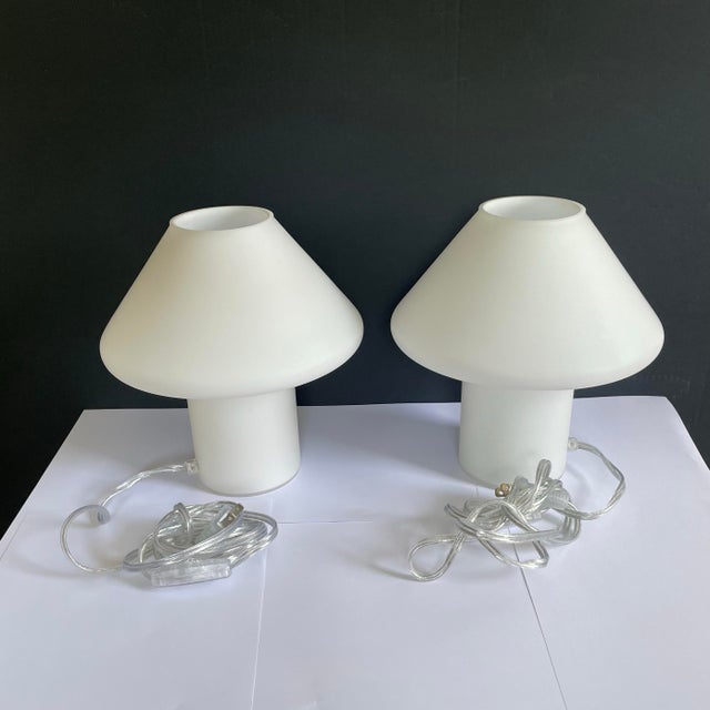 A pair of 1980’s Hala Zeist table lamps. The lamps are in a solid opaque glass with a mushroom shape. The lamps are in...