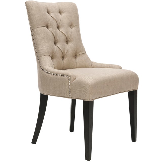 A buttoned-up elegance infuses the antique gold linen upholstered Chair with a espresso finish on the legs. A high back,...