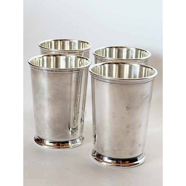 This is a wonderful set of 4 Reed & Barton circa 1980s mint julep cups in the classic tapered shape. The heavy silver...