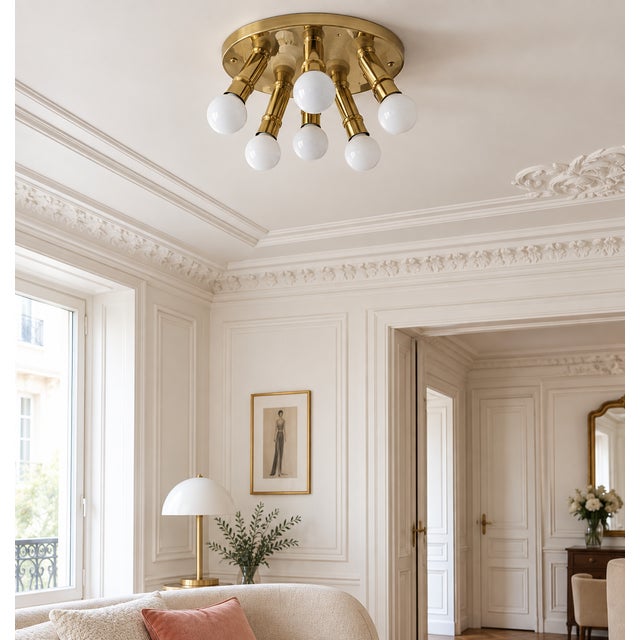 Elegant german mid-century ceiling light from the 1970s, featuring six gracefully curved brass-finished arms and six...