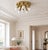 Elegant german mid-century ceiling light from the 1970s, featuring six gracefully curved brass-finished arms and six...