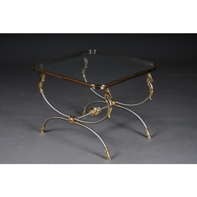 20th century modern designer side table, chrome brass, classical style Chrome / brass frame, curved and flanked by horse...
