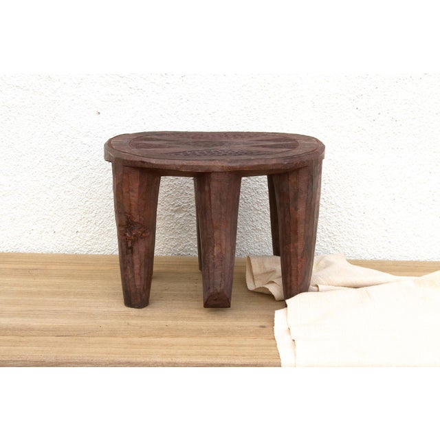 A unique piece of African art, this vintage Nupe table from Nigeria is a must-have for collectors and enthusiasts of Nupe...