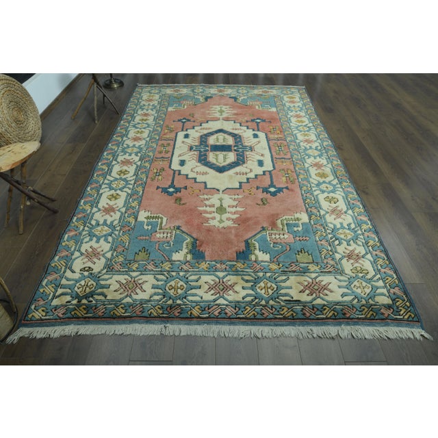 Vintage Turkish Hand-Knotted vintage rug is a semi-antique vintage area rug.'70s Eastern region of Turkey's unique rug is...