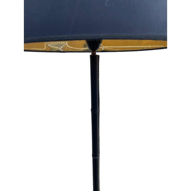 A Rare French Midcentury Modern hand stitched leather floor lamp by Jacques Adnet, circa 1955. Adnet had a rare talent for...