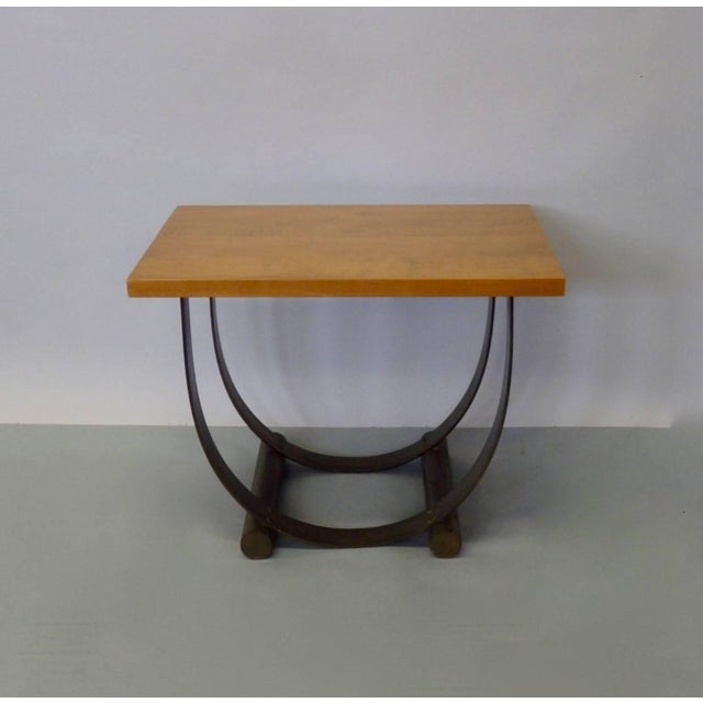 Flat band steel with cylinder tell bases support solid maple top. Top has been restored base is in original patina finish.