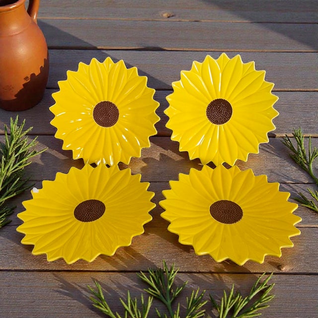 This set of four ceramic yellow sunflower shaped harvest spice serving plates is perfect for adding a touch of country...